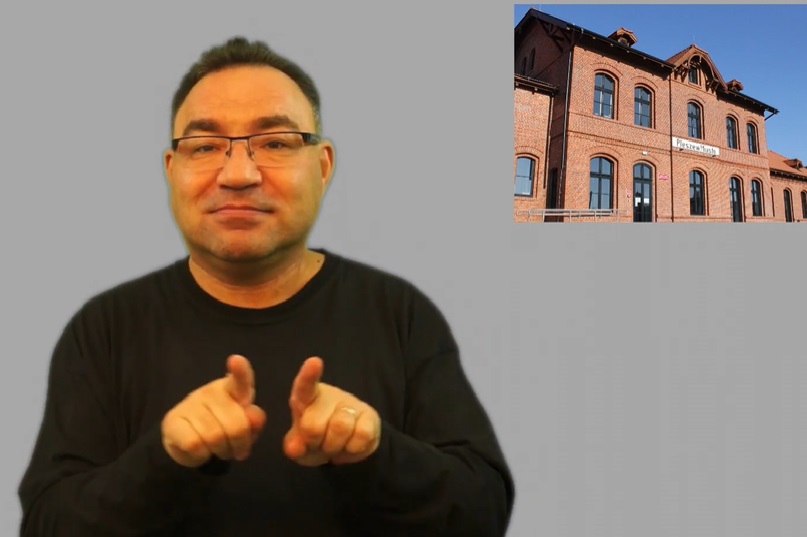 Na zdjęciu kadr z filmu w języku migowym przedstawiający mężczyznę posługującego się tym językiem